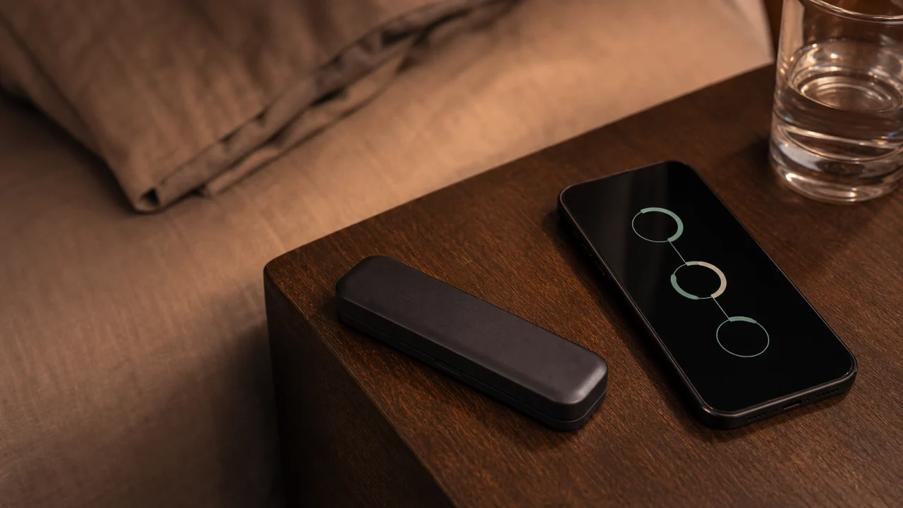 An illustrative closed concept case beside a phone showing three abstract progress markers